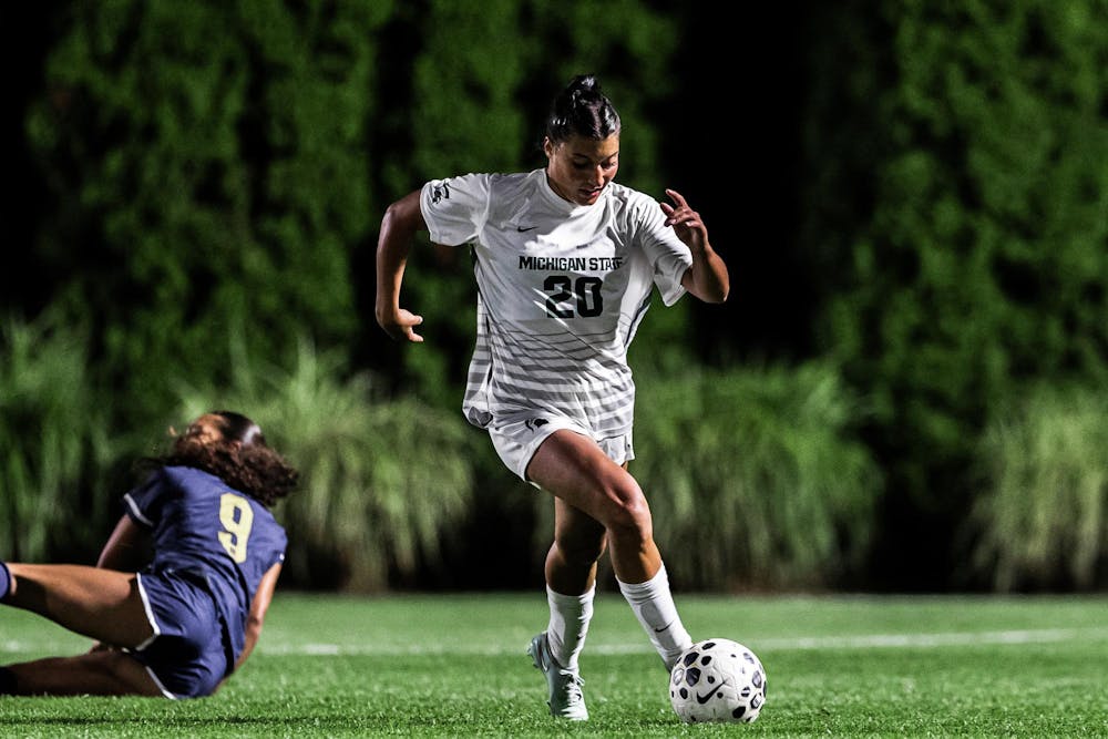 <p>Michigan State forward Shelby Vaughn (20) dribbles past Notre Dame defense at DeMartin Soccer Complex in East Lansing, Michigan on Sept. 4, 2025. </p>