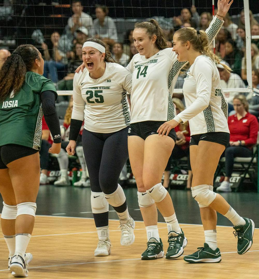 <p>The Michigan State University volleyball team celebrates after scoring a point against Wisconsin on Oct. 27, 2023 at the Breslin Center.</p>