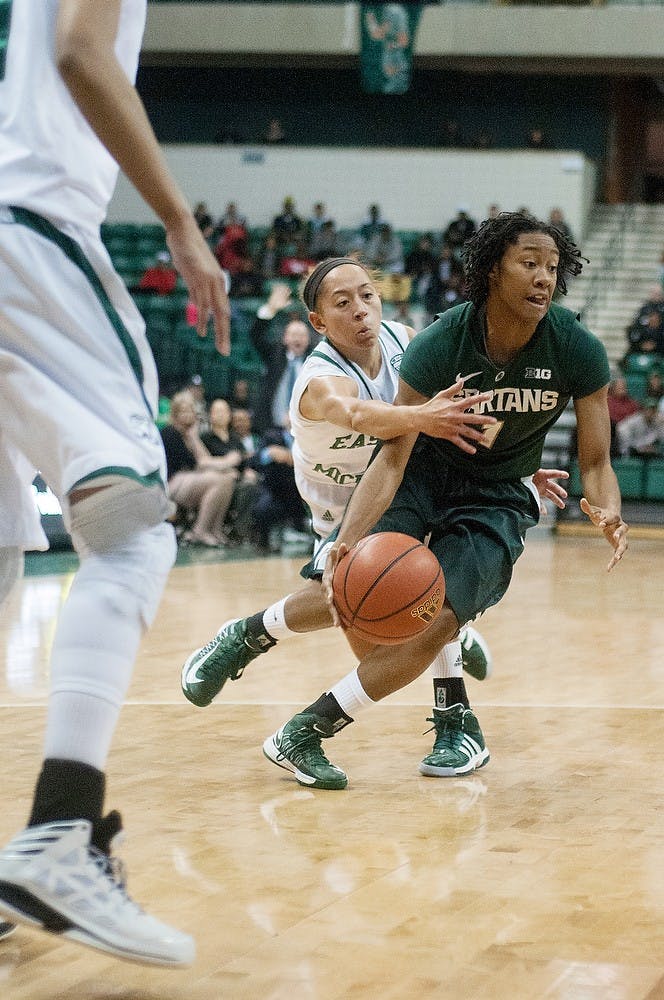 	<p>Senior guard Jasmine Thomas dribbles past Eastern Michigan guard Desyree Thomas on Thursday, Nov. 15, 2012, at the Convocation Center in Ypsilanti, Mich. The Spartans defeated the Eagles, 60-49. Julia Nagy/The State News</p>