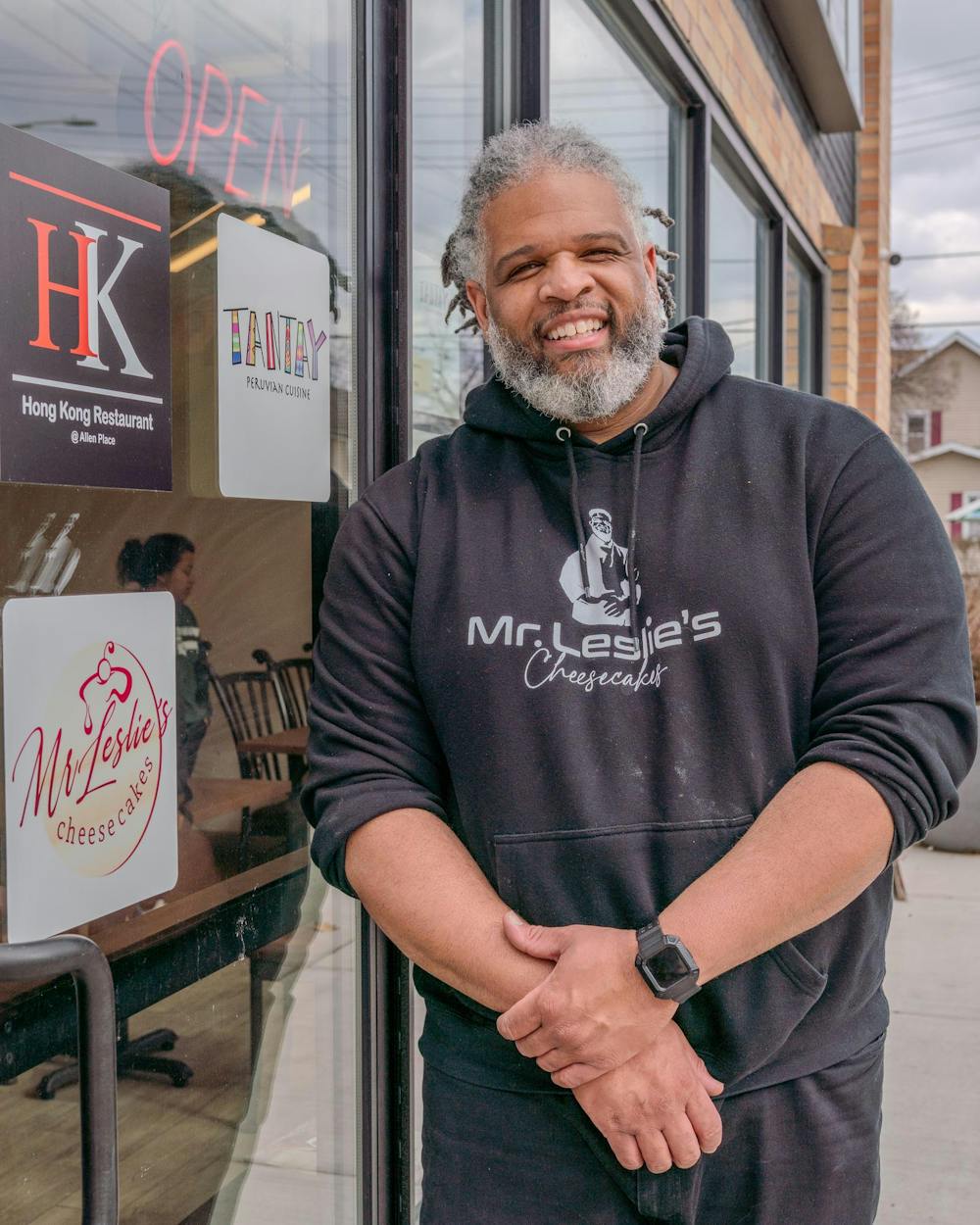 <p>Marcus Leslie Sr., owner of Mr. Leslie’s Cheesecakes, standing outside of his business location in Lansing on Feb. 23, 2024.</p>