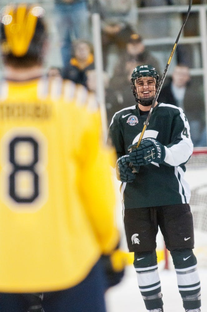 Junior defenseman Jake Chelios laughs before the game starts Nov. 9, 2012, at Yost Ice Arena in Ann Arbor. The Spartans were defeated by the Michigan Wolverines by a score of 5-1 in the first game of a two game series. Adam Toolin/The State News