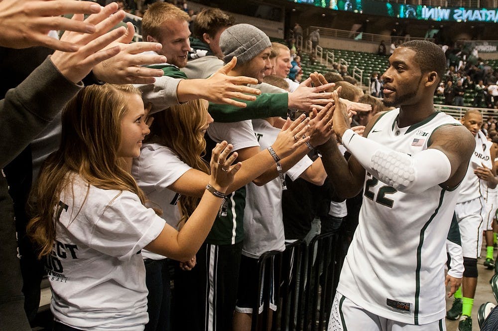 	<p>Junior forward Branden Dawson gives the student section high fives after the game against McNeese State on Nov. 8, 2013, at Breslin Center. The Spartans defeated the Cowboys, 98-56. Khoa Nguyen/The State News</p>
