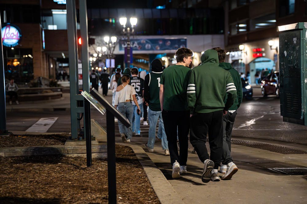 <p>Fans head home after watching UConn defeat Michigan State in the NCAA men’s basketball tournament regional semifinal game on Grand River in East Lansing, Michigan on Friday, March 27, 2026.</p>