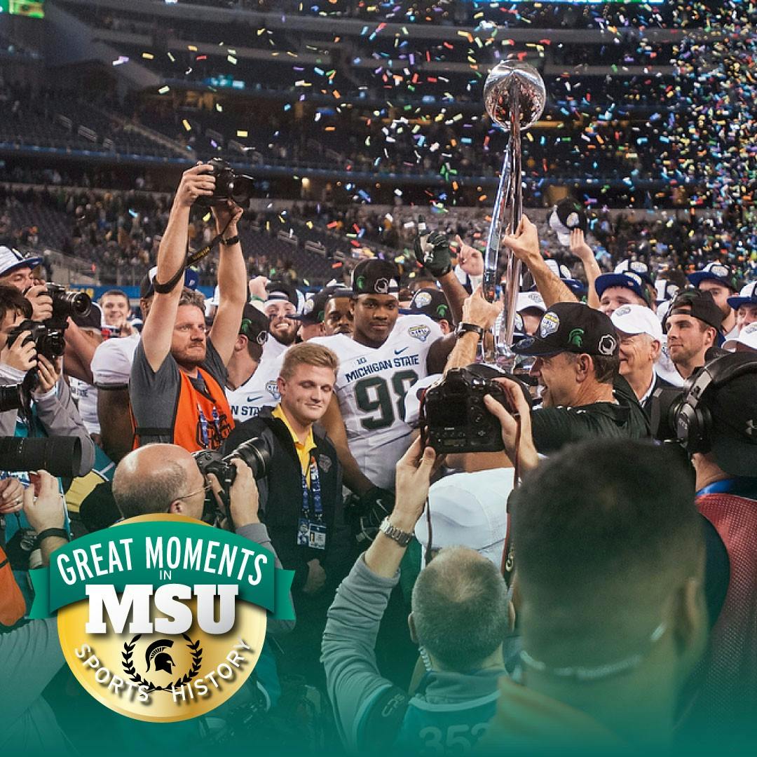 Head Coach Mark Dantonio holds the trophy and celebrates the win with his team Jan. 1, 2015, during the Cotton Bowl Classic football game against Baylor at AT&T Stadium in Arlington, Texas. The Spartans defeated the Bears and claimed the Cotton Bowl victory, 42-41. Photo by Erin Hampton. Design by Daena Faustino.