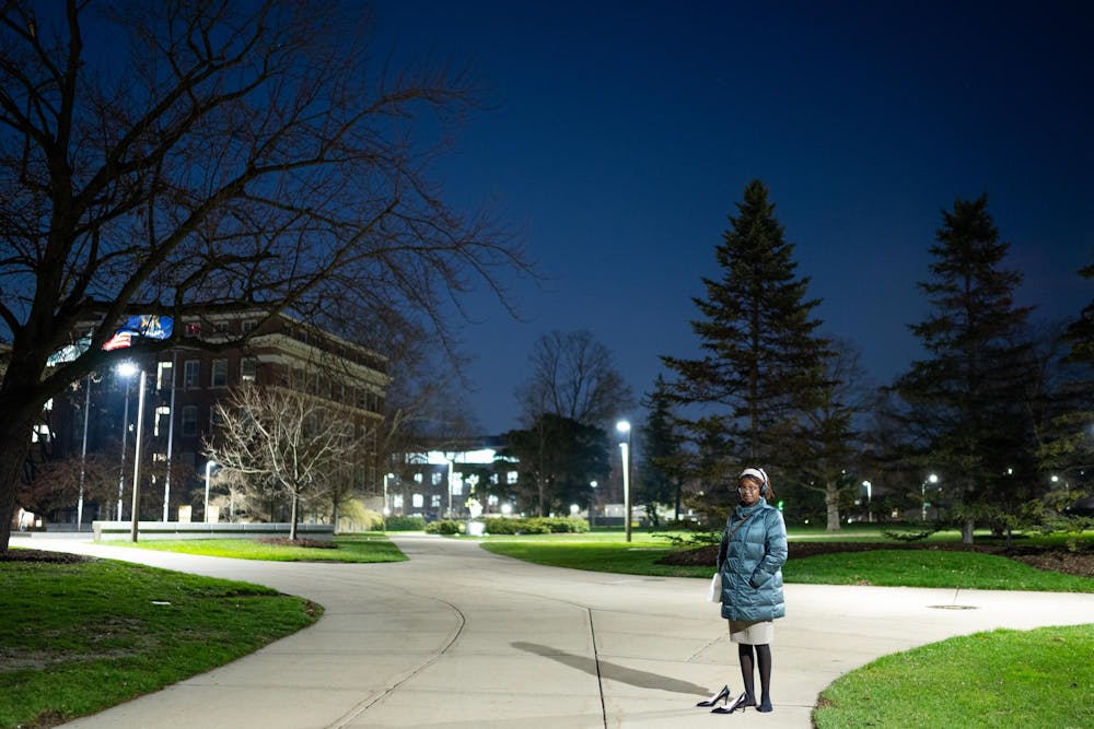 <p>Michigan State sophomore Simone waits to signal members of the Hurriya Coalition and Michigan State Sunrise as they protest outside of the Hannah Administration Building in East Lansing, Michigan on April 11, 2025. Simone was a part of the network to let protestors know which door the arrestees were being transferred out of.</p>
