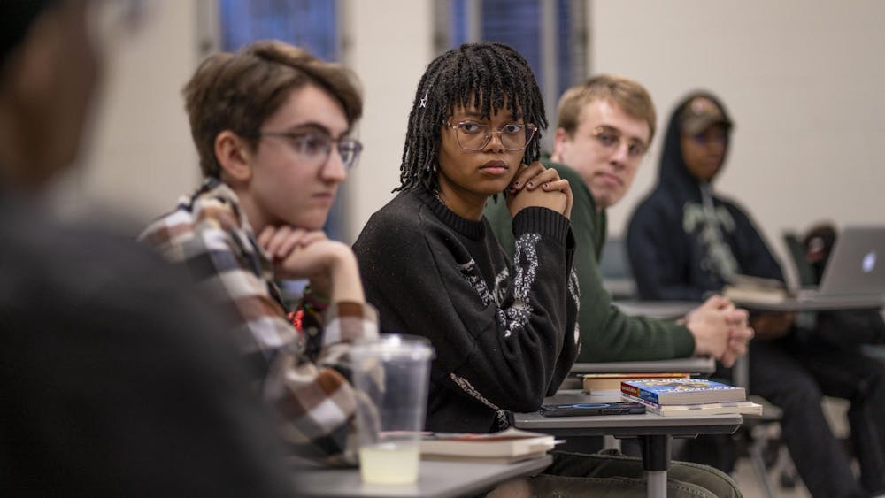 English freshman Abby Brooks listens to discussion during Sigma Tau Delta's Banned Book Night at Wells Hall on April 21, 2025.