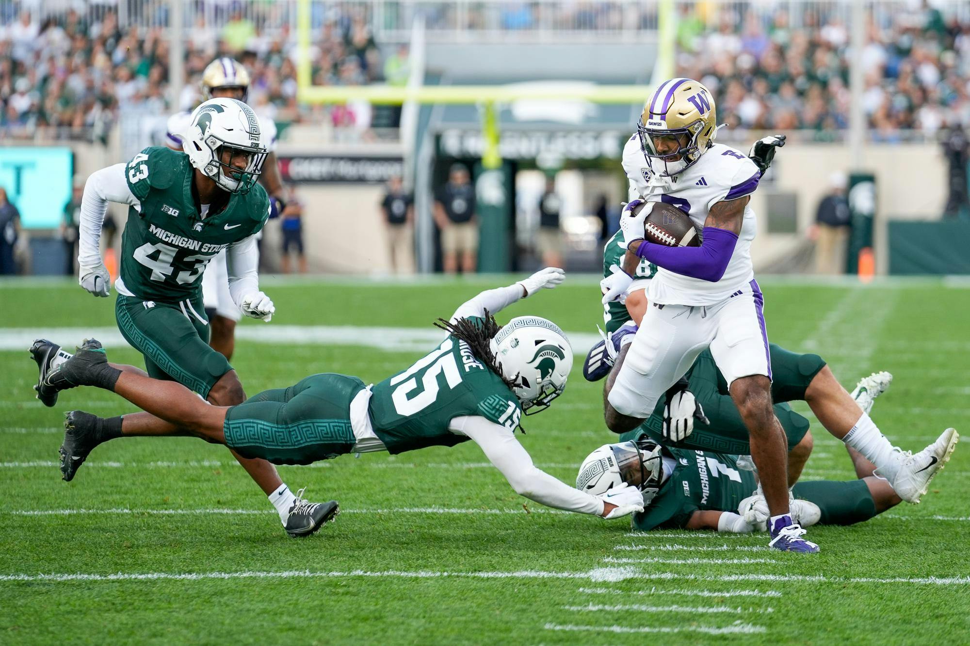 University of Washington sophomore wide receiver Ja’Lynn Polk escapes MSU defense to score a touchdown during a game at Spartan Stadium on Sept. 16, 2023.