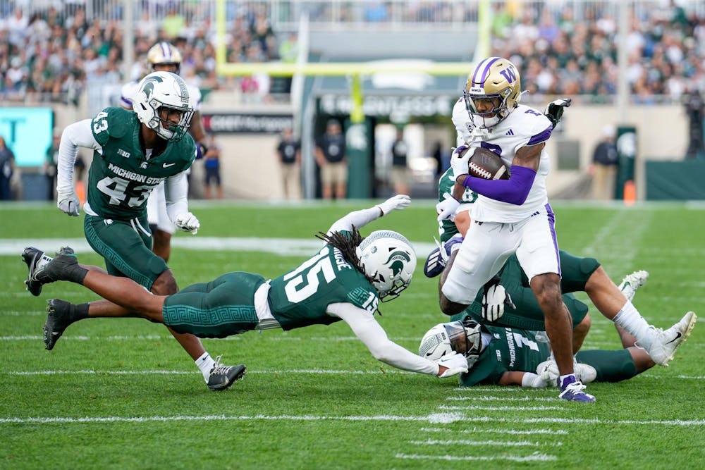 University of Washington sophomore wide receiver Ja’Lynn Polk escapes MSU defense to score a touchdown during a game at Spartan Stadium on Sept. 16, 2023.