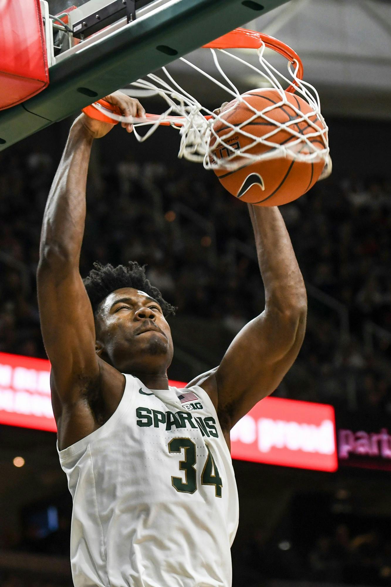 <p>Freshman forward Julius Marble (34) dunks during the game against Eastern Michigan on Dec. 21, 2019 at the Breslin Center. The Spartans defeated the Eagles, 101-48.</p>