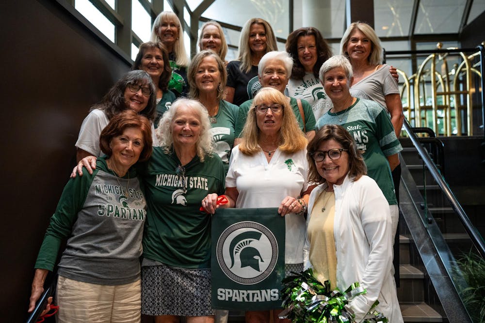 A group of Michigan State University Alumni pose for a photo at the Kellogg Center in East Lansing, Michigan, July 12, 2024. Beginning their friendship in Holden Residence Hall during the 1973-1974 school year, they decided to have a reunion at Michigan State to commemorate 50 years of friendship.