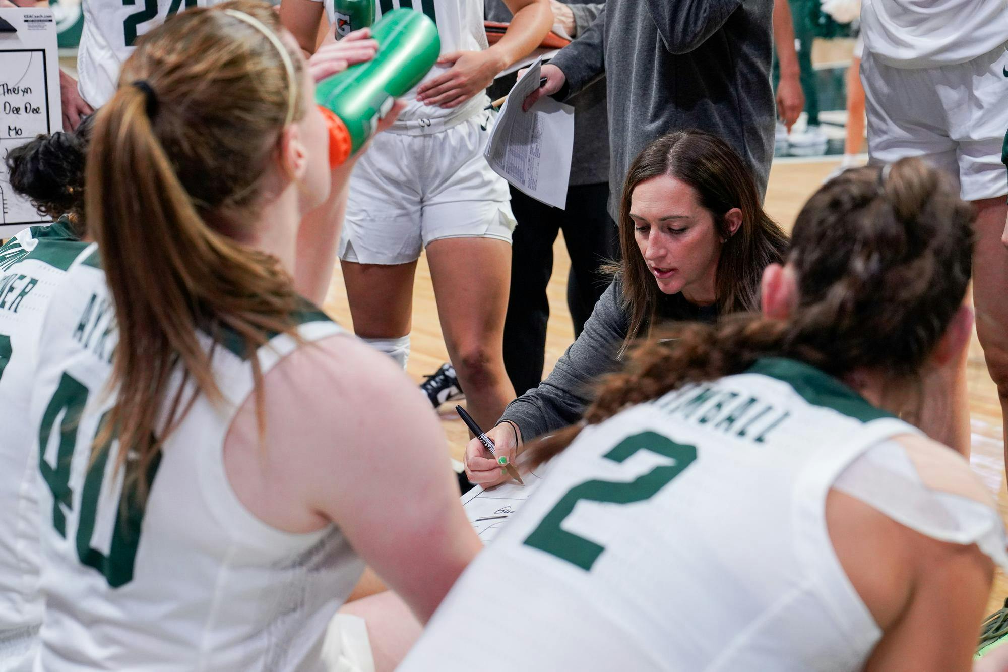 <p>Head coach Robyn Fralick draws out a play for the fourth quarter during the season-opening exhibition game against Davenport University at the Breslin Center on Nov. 2, 2023. The Spartans annihilated the Panthers with a score of 99-45.&nbsp;&nbsp;</p>