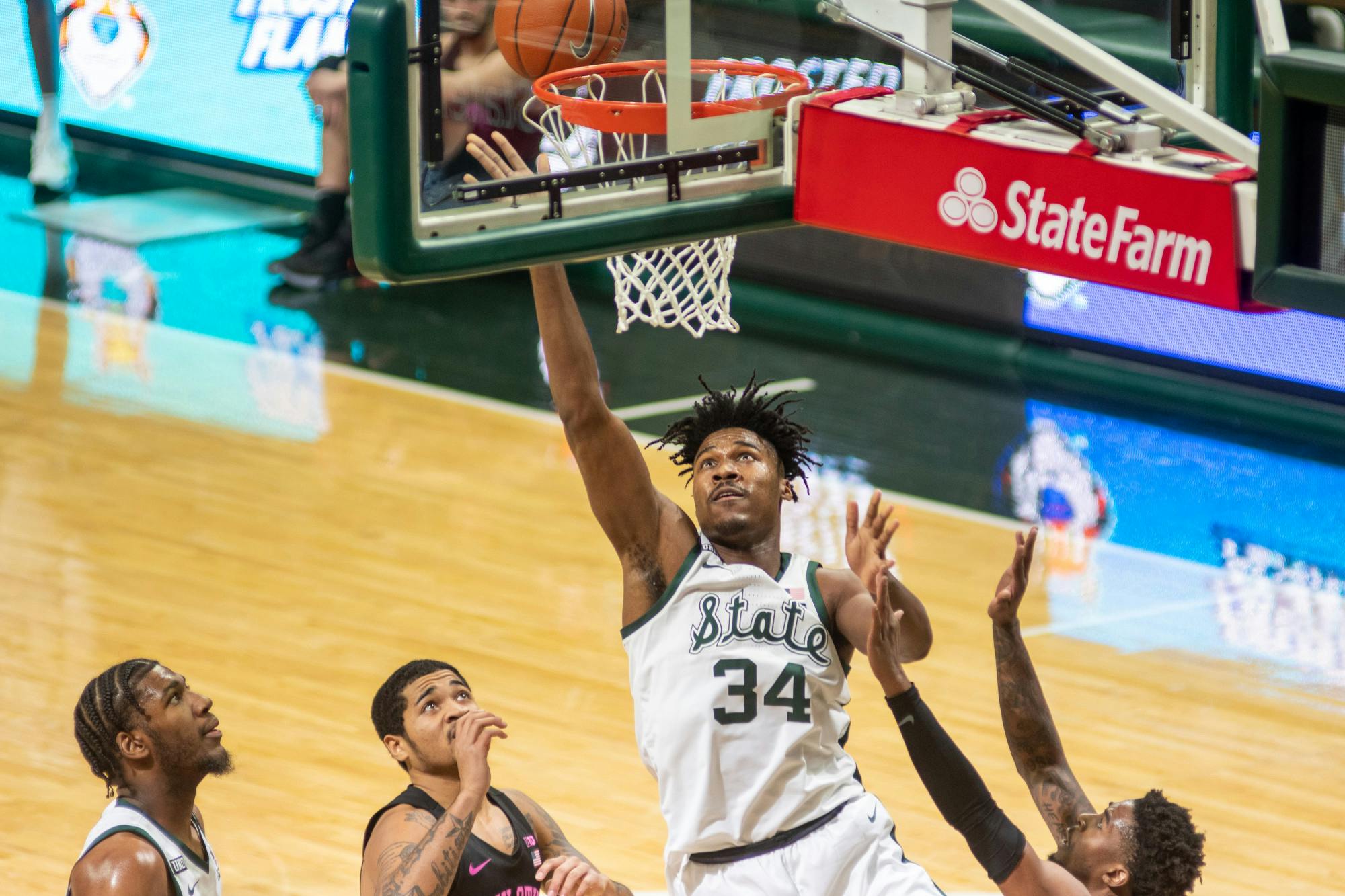 <p>Sophomore Julius Marble II sinks a second-chance layup during the first half of the Spartans&#x27; game against Penn State on Feb. 9, 2021.</p>