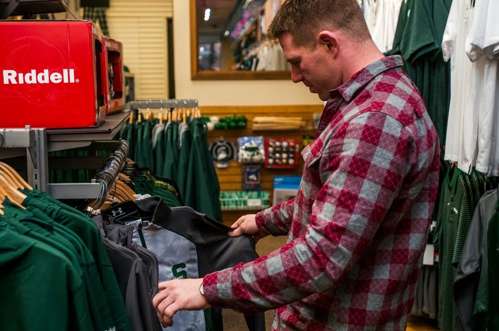 MSU Alumnus Rex Kendele shops on March 23, 2016 at 421 E. Grand River. Kendele was a wrestler at MSU and graduated in 2009. 