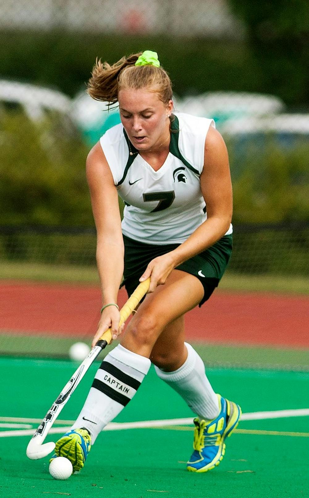 <p>Senior midfield Heather Howie dribbles the ball during a game against the University of Maine Aug. 31, 2014, at Ralph Young Field. The Spartans defeated the Black Bears, 5-4 in overtime. Jessalyn Tamez/The State News </p>