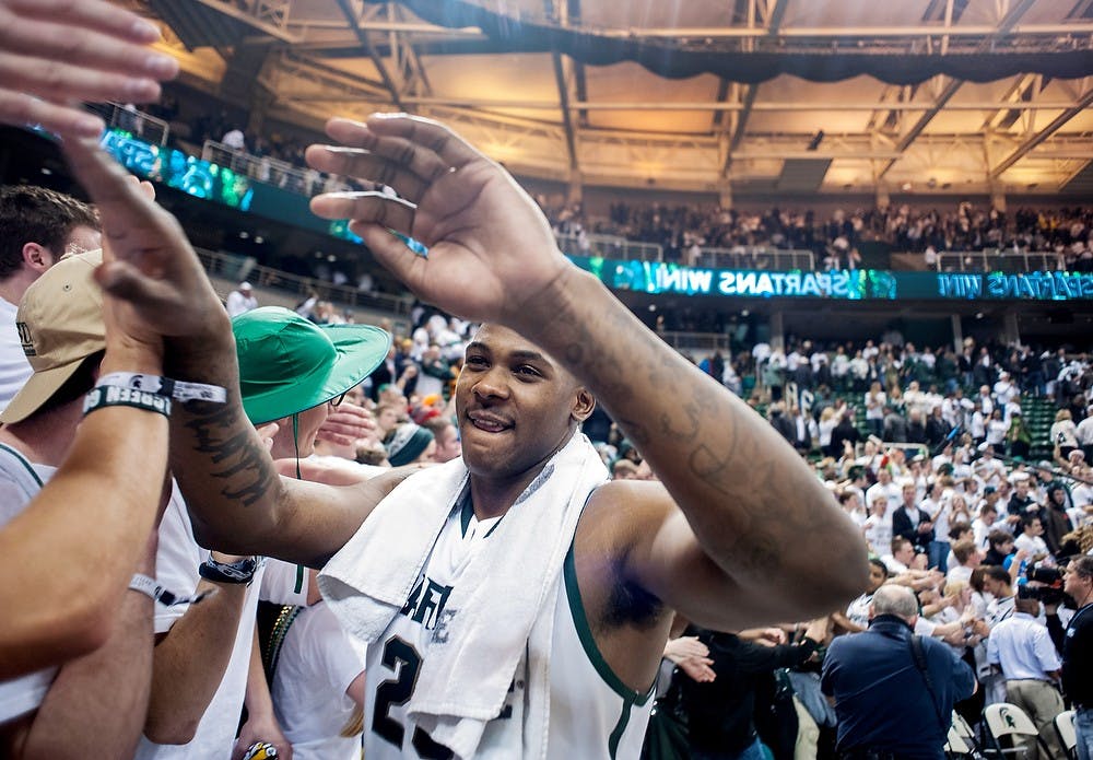 	<p>Senior center Derrick Nix high-fives Izzone members at the conclusion of the game against rival Michigan. <span class="caps">MSU</span> defeated U-M, 75-52, Tuesday, Feb. 12, 2013, at Breslin Center. Justin Wan/The State News</p>