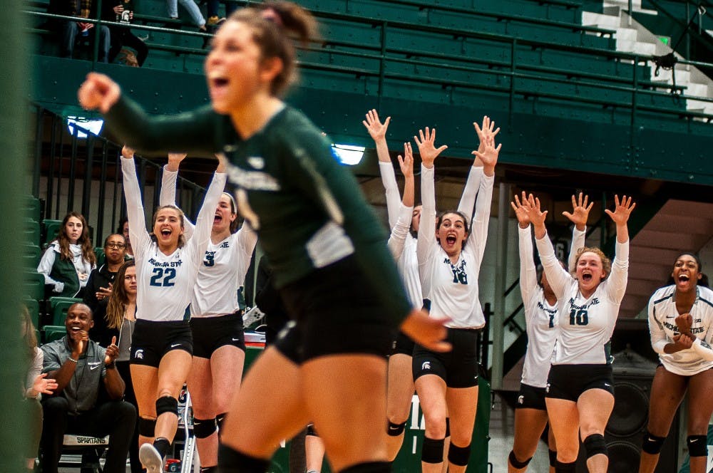Spartans celebrate during the game against Wisconsin on Oct. 27, 2018 at Jenison Fieldhouse. The Badgers beat the Spartans, 3-0.