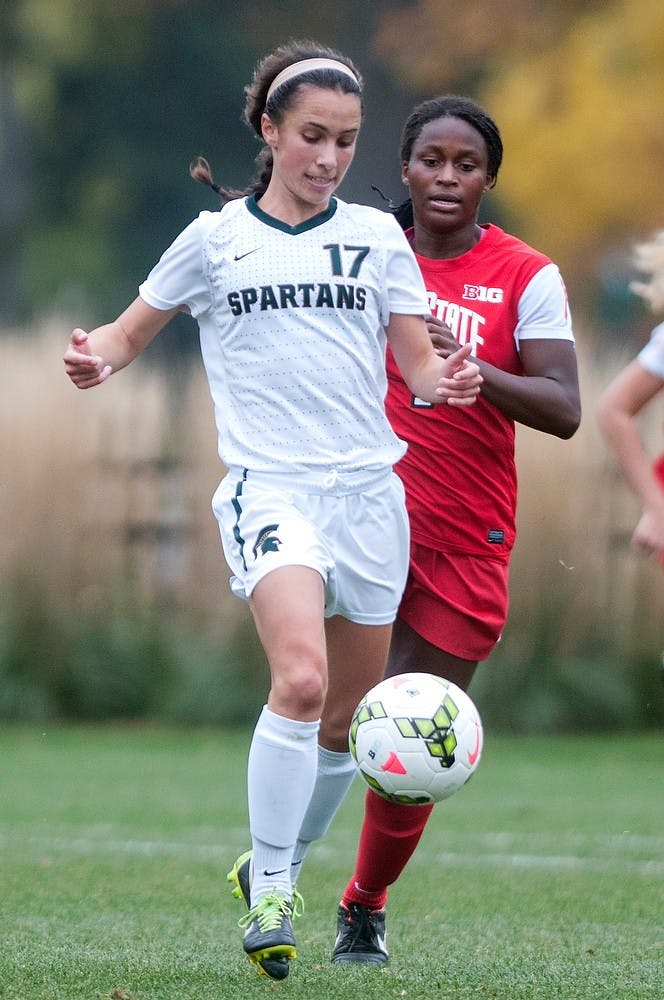 <p>Junior midfielder Sarah Kovan runs from Ohio State forward Nichelle Prince on Oct. 16, 2014, at the DeMartin Soccer Stadium at Old College Field. The Spartans defeated the Buckeyes, 2-1. Jessalyn Tamez/The State News </p>