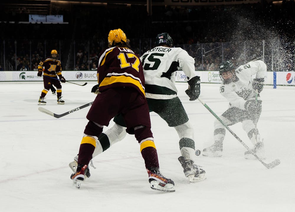 Sophomore forward Tanner Kelly (26) skirts to a stop during a game against University of Minnesota at Munn Ice Arena on Dec. 2, 2022. The Spartans lost to the Gophers with score 5-0. 