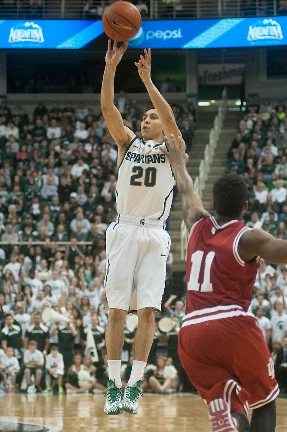 	<p>Junior guard Travis Trice shoots a three-pointer during the game against Indiana on Jan. 21, 2014. <span class="caps">MSU</span> beat Indiana, 71-66. Julia Nagy/The State News</p>