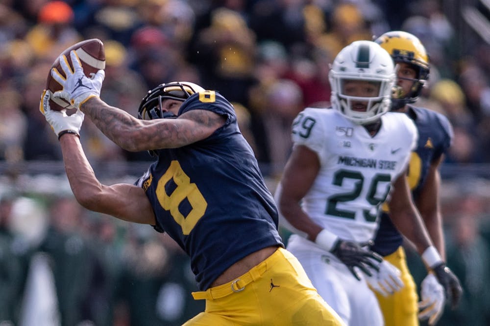 <p>Michigan wide receiver Ronnie Bell (8) brings in a pass during the game Nov. 16, 2019 at Michigan Stadium. The Spartans fell to the Wolverines, 44-10.</p>