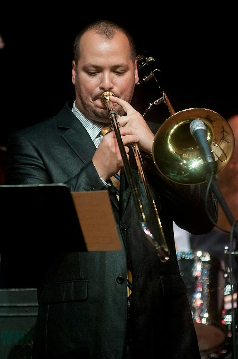 	<p>Assistant professor of jazz trombone Michael Dease plays his instrument during the <span class="caps">MSU</span> Professors of Jazz concert Aug. 28, 2013 at the Pasant Theatre. The professors dedicated the performance to the 50th anniversary of the March on Washington. Katie Stiefel/The State News</p>