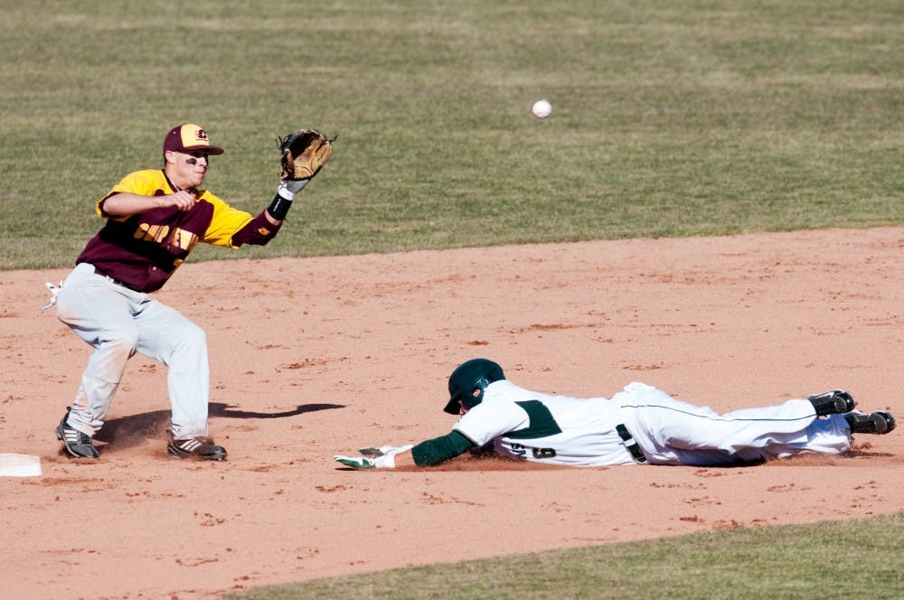 Sophomore outfider Jordan Keur tries to beat the ball to the base during the bottom of the eight inning. Keur was called safe. However, the Spartans still lost to Central Michigan, 3-1, on Wednesday at McLane Stadium at Kobb Field. Josh Radtke/The State News