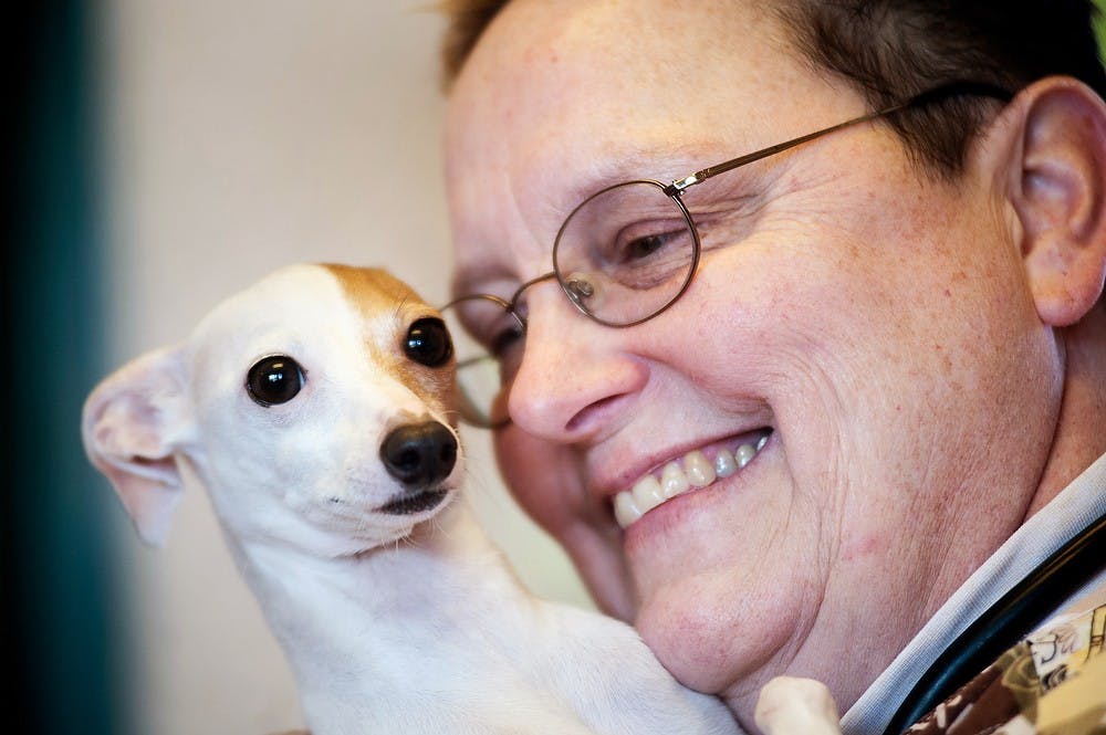 	<p>Veterinarian Joyce Heideman holds Jezabelle while talking with The State News reporter at Southside Animal Hospital.  Jezabelle was rescued from the home of former <span class="caps">MSU</span> medical student Andrew Thompson, who pleaded guilty to animal killing in 2012. Justin Wan/The State News</p>