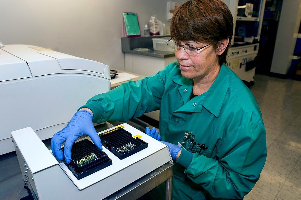 	<p>Med tech Nancy Nagele tests samples for chlamydia on Tuesday, Oct. 9, 2012 in the Olin Health Center Laboratory. Nagele was repeating a run to ensure the sample was actually positive for chlamydia. Julia Nagy/The State News</p>