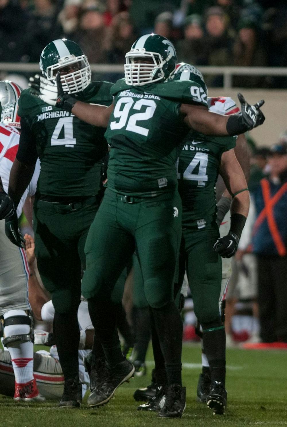 <p>Junior defensive lineman Joel Heath celebrates after his sack on Ohio State quarterback J.T. Barrett during the game on Nov. 8, 2014, at Spartan Stadium. The Spartans were defeated by the Buckeyes, 49-37. Raymond Williams/The State News</p>