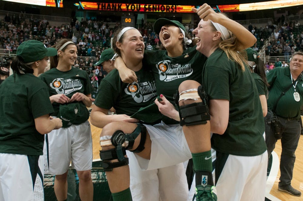 <p>From left to right, junior center Jasmine Hines, junior center Madison Williams and junior forward Becca Mills celebrate the Big Ten Championship win March 2, 2014, at Breslin Center. The Spartans defeated the Hoosiers 76-56. Julia Nagy/The State News</p>