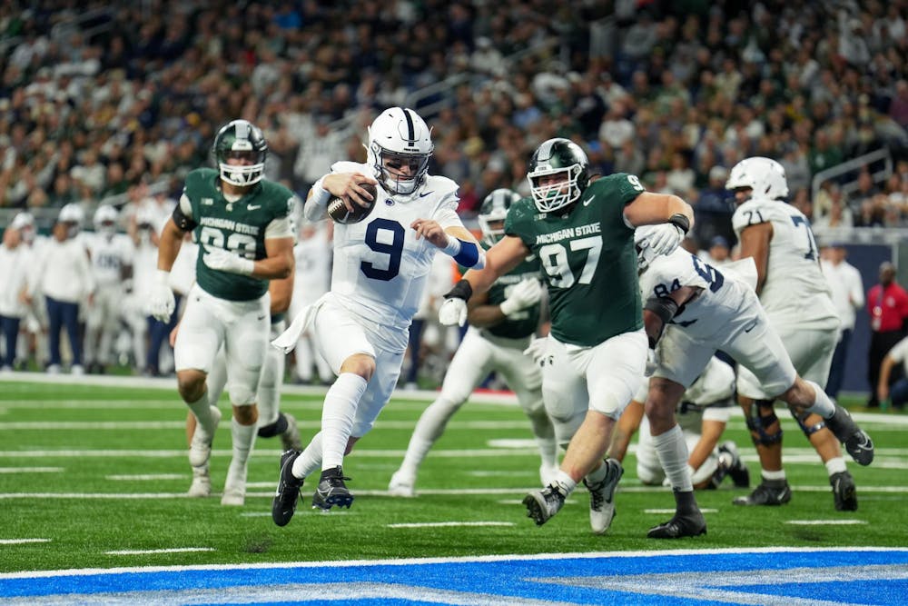 <p>Redshirt freshman quarterback Beau Pribula (9) running the ball during a game between Penn State and Michigan State at Ford Field on Nov. 24, 2023.</p>