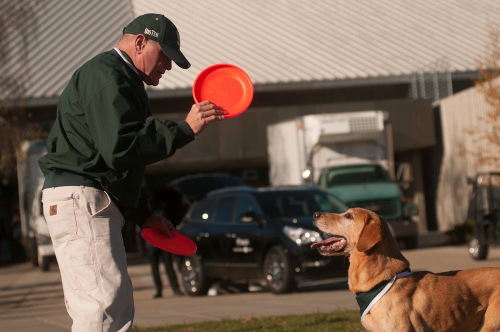 <p>Zeke the&nbsp;Wonderdog&nbsp;does some warm up tricks with owner Jim Foley before the game against Maryland on Nov. 14, 2015 at Spartan Stadium. The Spartans defeated the Terrapins, 24-7.</p>