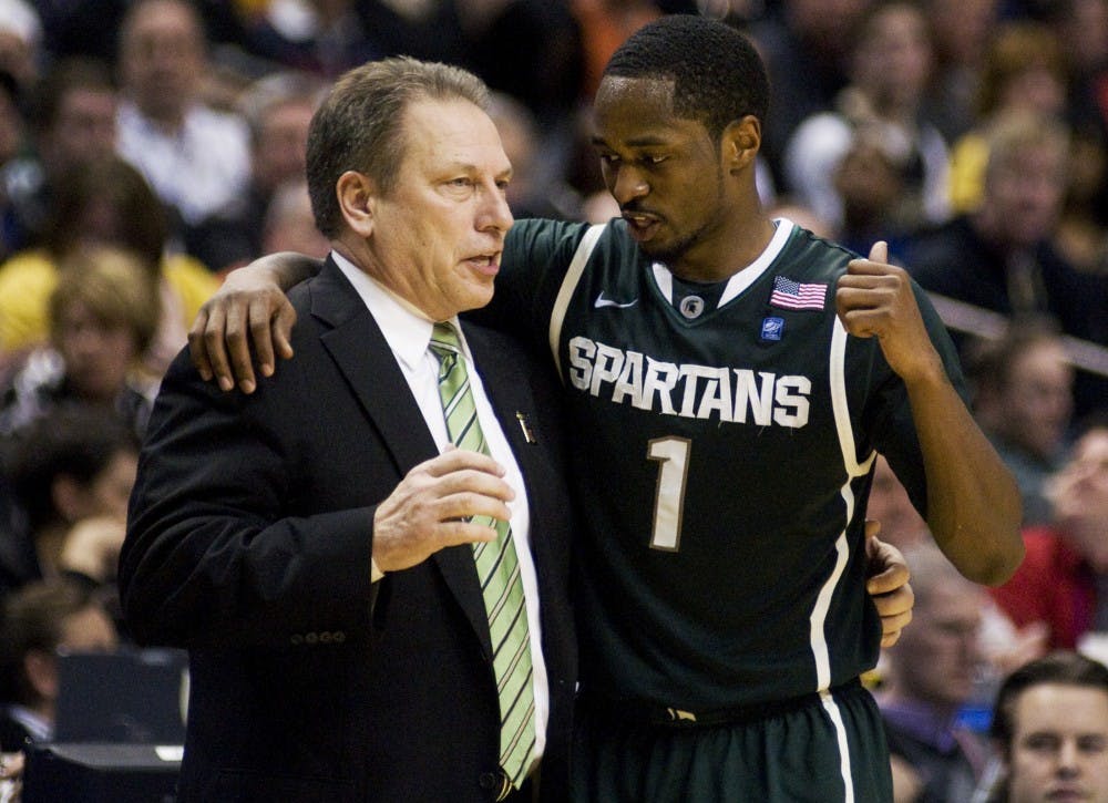 Head coach Tom Izzo talks with senior guard Kalin Lucas between plays Friday at Conseco Fieldhouse in Indianapolis. The Spartans defeated the Purdue Boilermakers 74-56 to advance in the 2011 Big Ten Tournament. Matt Radick/The State News