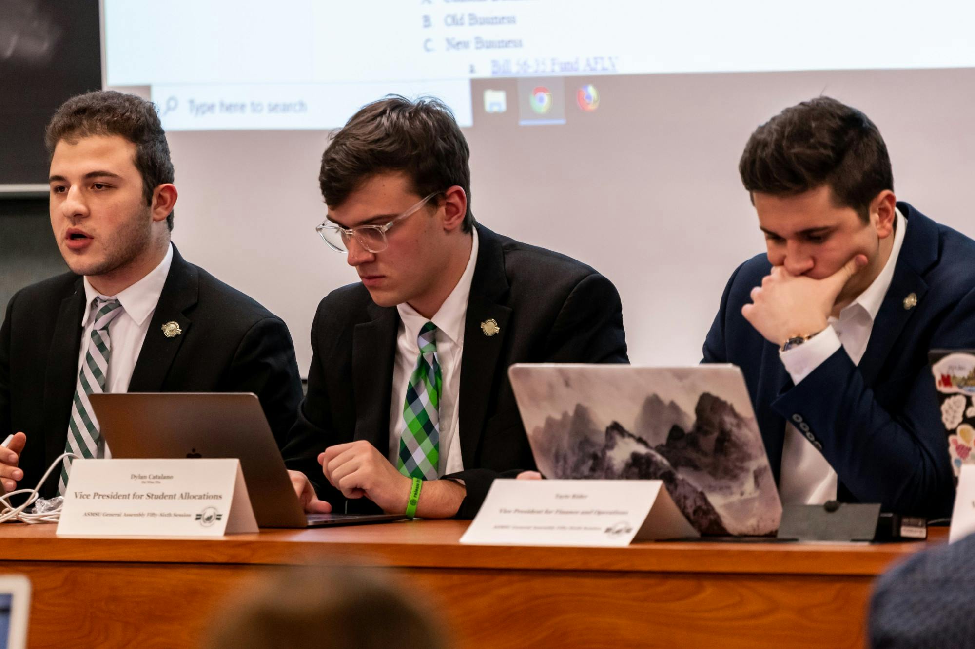 <p>ASMSU President Mario Kakos (left), Vice President for Student Allocations Dylan Catalano (center), and Vice President for Financial Operations Tayte Rider (right) at an ASMSU General Assembly meeting in the MSU International Center on Jan. 16, 2020.</p>