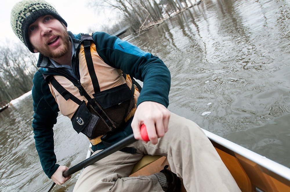 <p>Alumnus Tim "Boot" Muhich paddles in a canoe March 20, 2014, on the Red Cedar River near Kruger Landing.  Baweja and his team plan to canoe the entire Mississippi River in less than 18 days this coming May.  Allison Brooks/The State News</p>