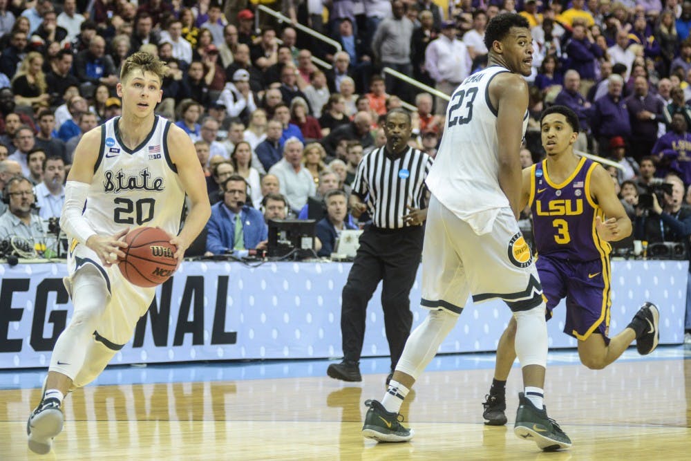 Senior guard Matt McQuaid (20) moves the ball during the game against LSU at Capital One Arena on March 29, 2019. The Spartans defeated the Tigers, 80-63.