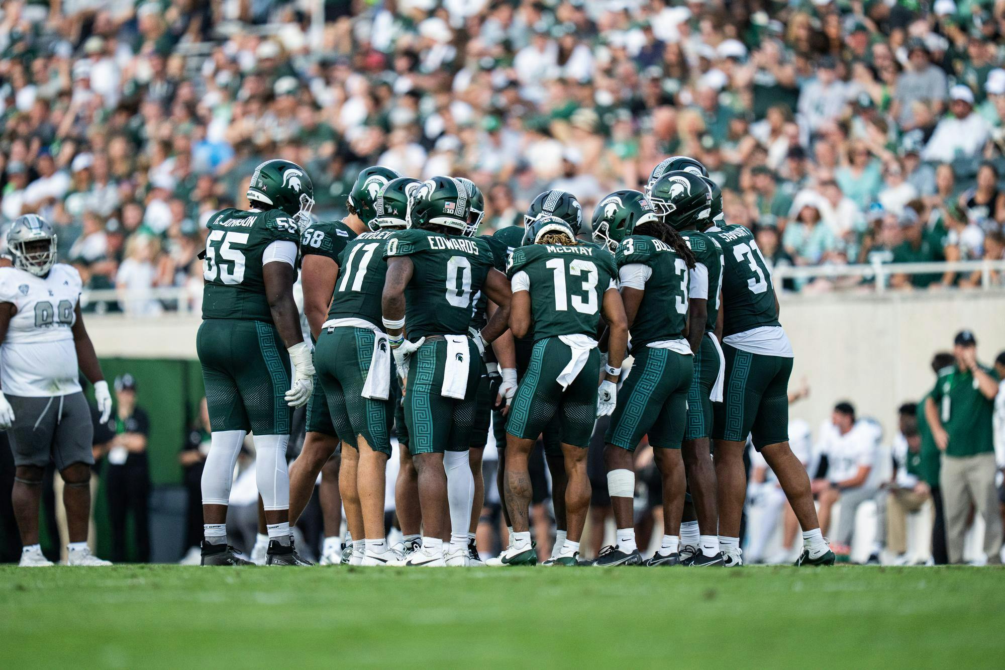 <p>Michigan State football players huddle as they get ready for their next play in Spartan Stadium in East Lansing, Mich., on Sept. 12, 2026.</p>