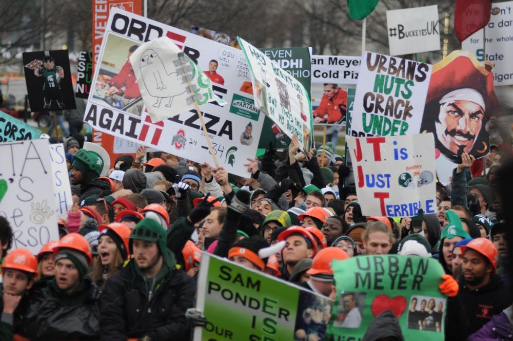 <p>True to tradition, Ohio State and MSU fans alike showed up with their funniest signs for ESPN's College GameDay on Nov. 8, 2014, at Demonstration field. Dylan Vowell/The State News</p>