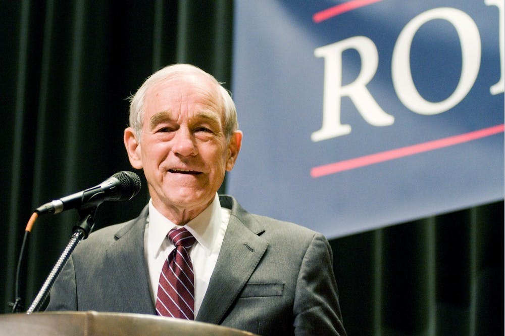 Republican presidential candidate Ron Paul takes the stage on Monday afternoon at Auditorium. His stop at MSU has been his biggest campaign site turnout so far. Justin Wan/The State News