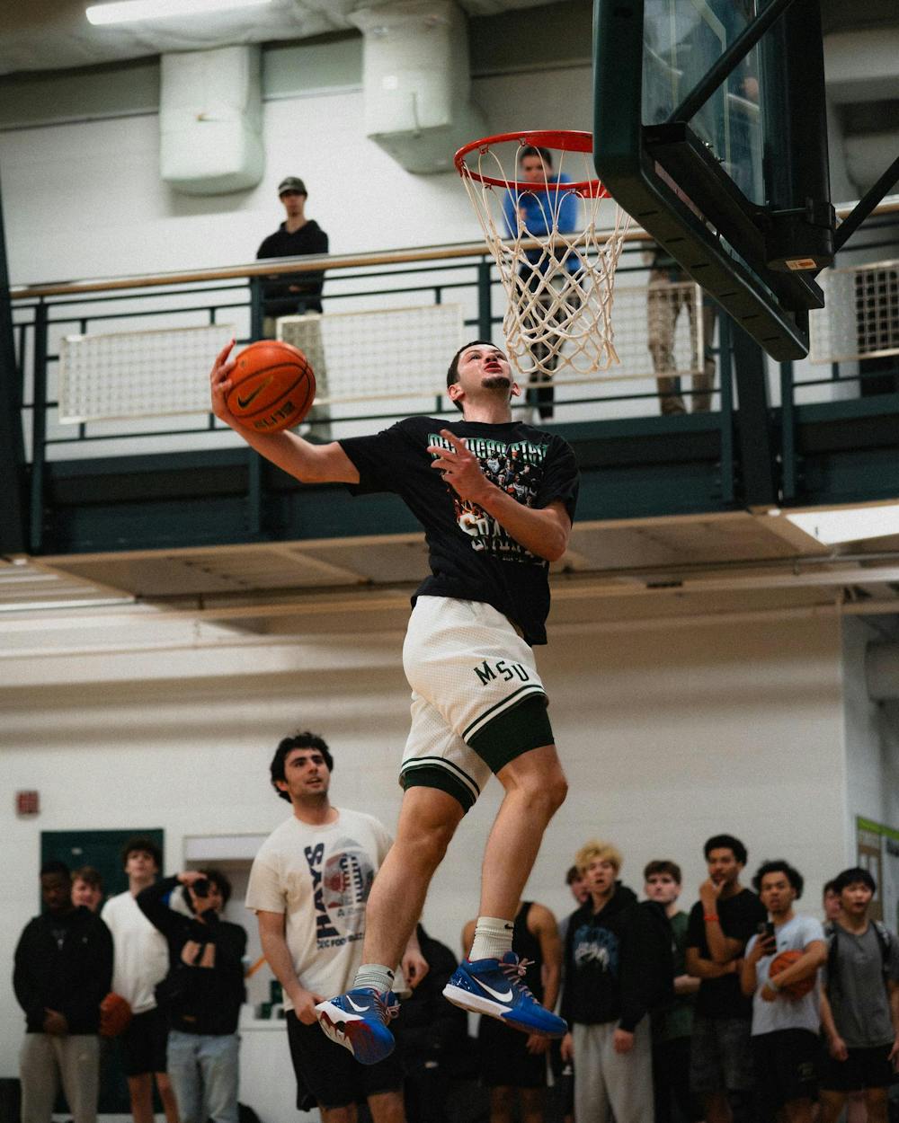 <p>Michigan State senior forward Frankie Fidler dunks the ball at IM East on April 16, 2025. The men's basketball team showed off their skills during pickup runs for students to watch.</p>