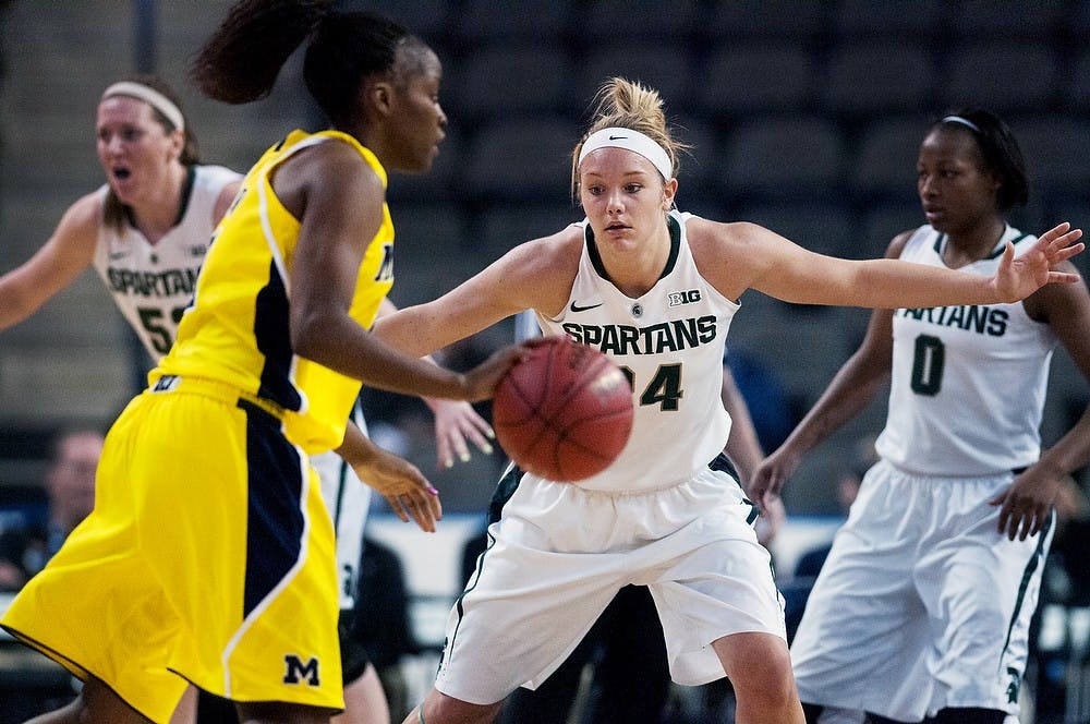 Senior forward Courtney Schiffauer guards Michigan forward Nya Jordan during the quarterfinals of the Big Ten Tournament against Michigan on March 8, 2013, at Sears Centre in Hoffman Estates, Ill. The Spartans defeated the Wolverines 62-46. Julia Nagy/The State News