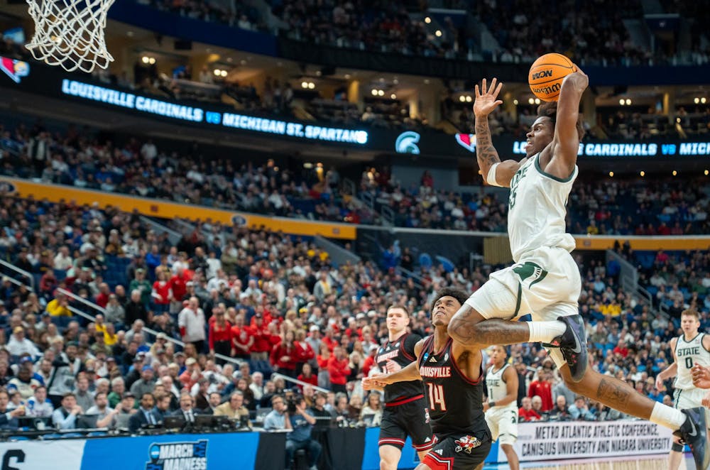 Junior forward Coen Carr (55) dunks during the March Madness matchup against University of Louisville at the KeyBank Center in Buffalo, New York on March 21, 2026.