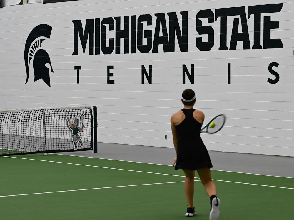 Matilde Morais, a senior, returns the ball during a rally in a singles match at the MSU Tennis Center on Friday, Feb. 6, 2026, in East Lansing.