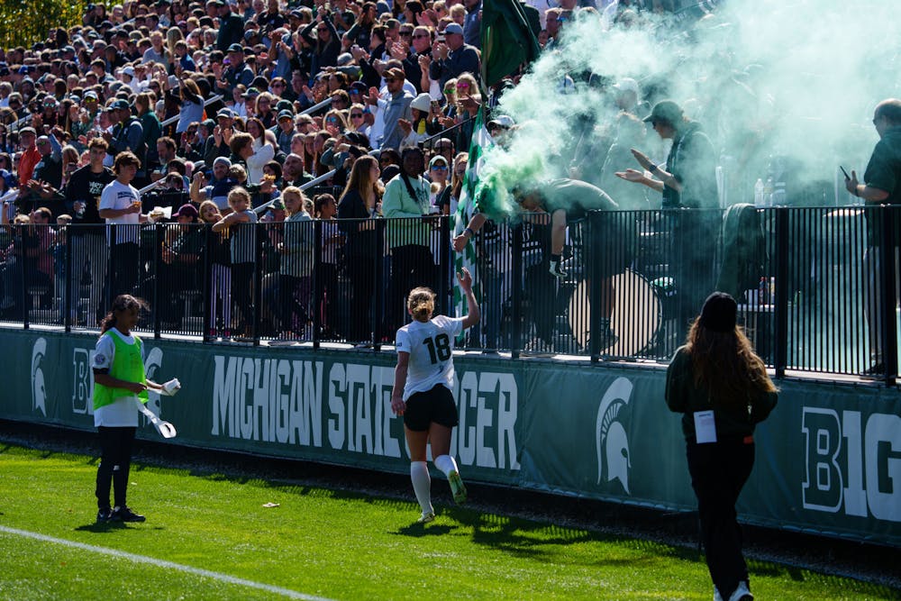<p>Michigan State junior midfielder Justina Gaynor celebrates with the student section after assisting a goal during a women&#x27;s soccer game against University of Michigan at DeMartin Stadium, on Oct. 9, 2022. The Spartans defeated the Wolverines 2-0.</p>
