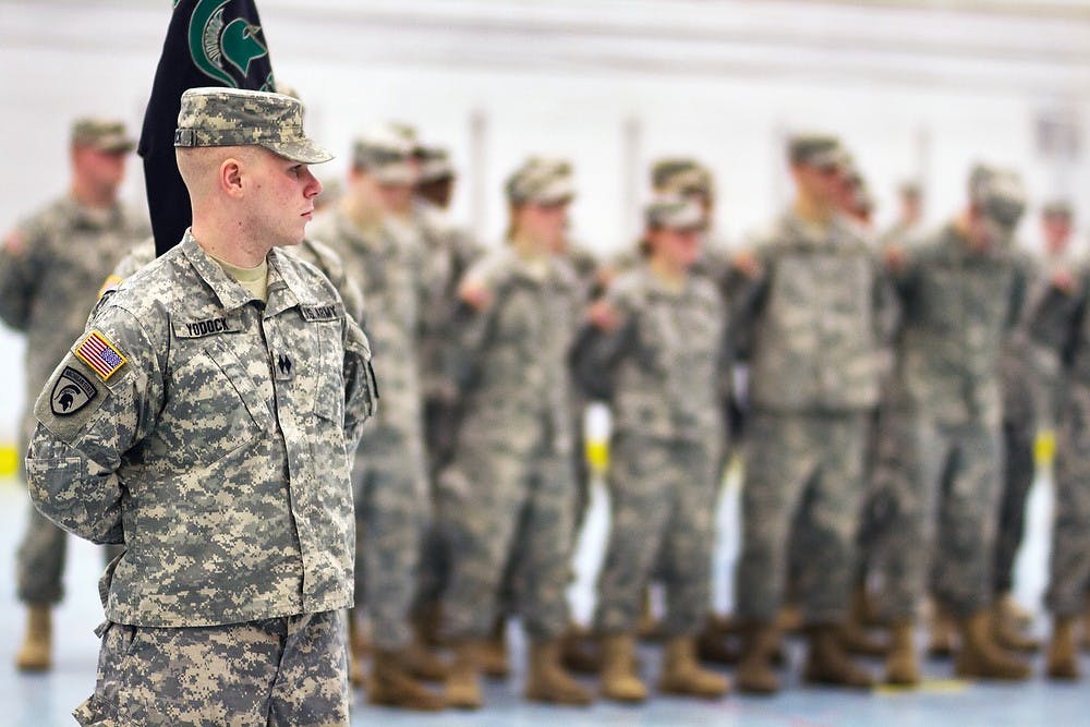 	<p>New Spartan Battalion Commander Nicholas Yodock stands at attention during the change-of-command Tuesday, Jan. 8, 2013 at Demonstration Hall. Yodock, a senior majoring in creative writing is assuming the position for the spring semester. Simon Schuster/The State News</p>