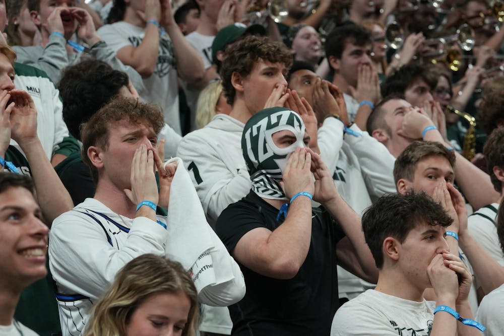 Students in the Izzone cheer at the Breslin Center in East Lansing, Michigan, on Tuesday, Feb. 17, 2026.