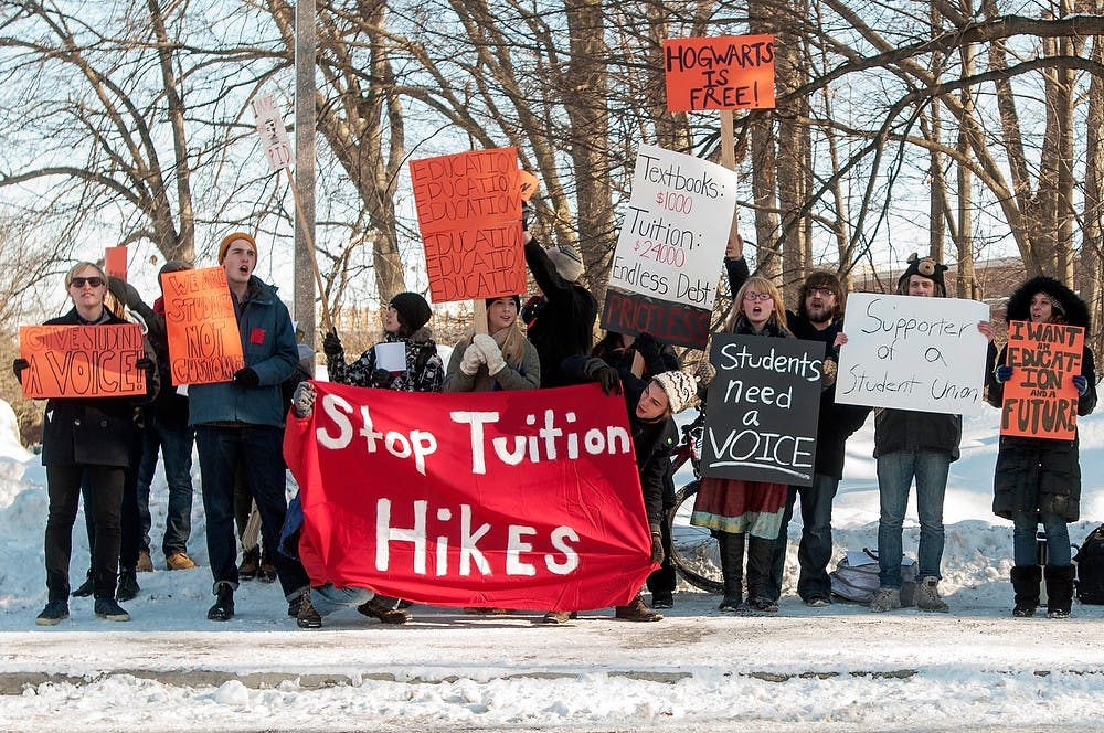 	<p><span class="caps">MSU</span> students protest rising tuition and a lack of student presence in the university before the State of the University address on Feb. 11, 2014, near the Wharton Center parking ramp. The protest was organized by <span class="caps">MSU</span> Students United. Casey Hull/The State News</p>