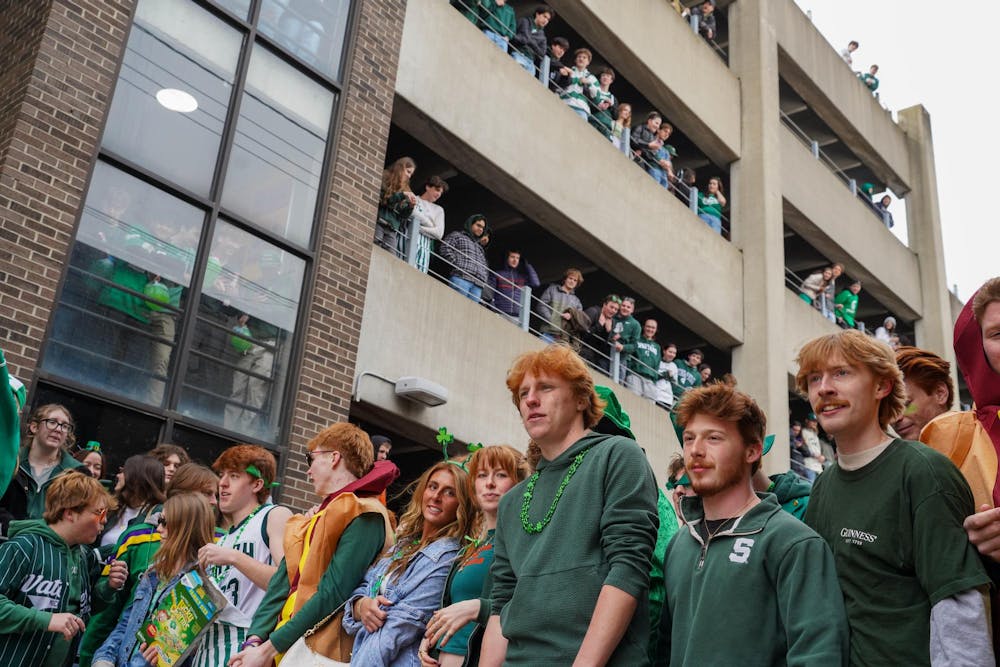 Michigan State University students gather in downtown East Lansing, Mich., for the Ginger Run on Saturday, March 14, 2026.
