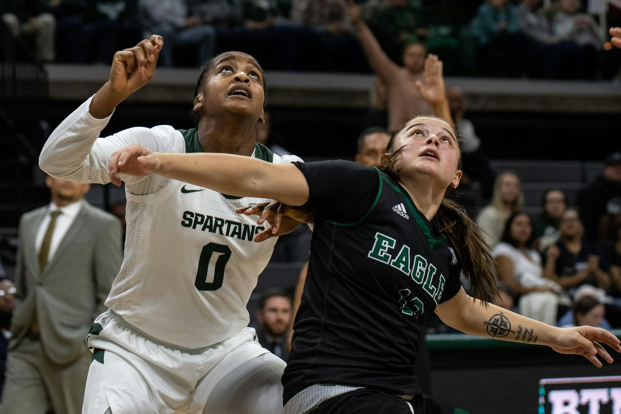 Redshirt senior guard Shay Colley (0) fights for a rebound during the game against Eastern Michigan Nov. 5, 2019 at the Breslin Center.