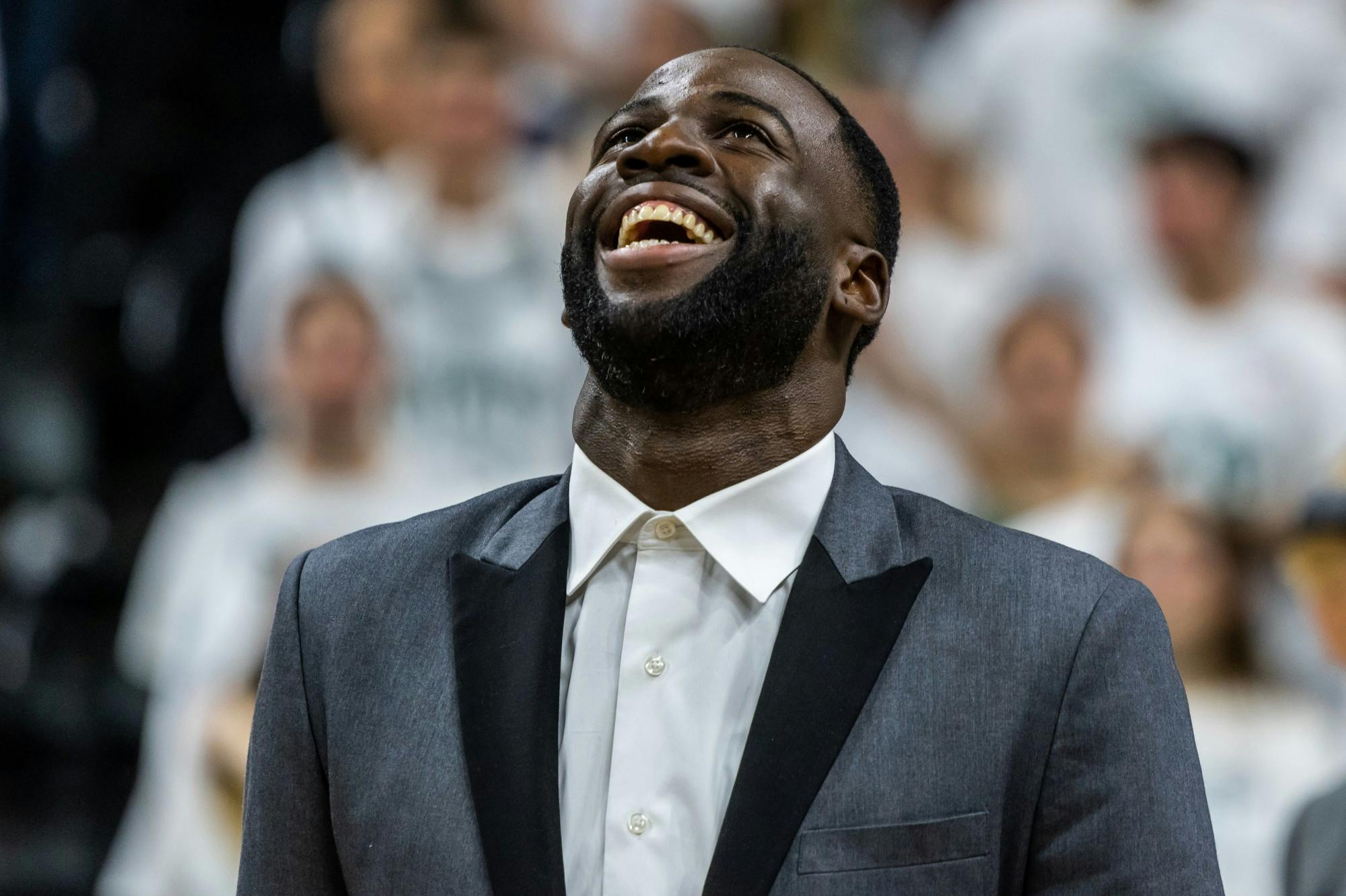 Former MSU and current Golden State Warriors basketball player Draymond Green laughs during his number-retirement ceremony at the Breslin Student Events Center on December 3, 2019. The Blue Devils defeated the Spartans, 87-75.